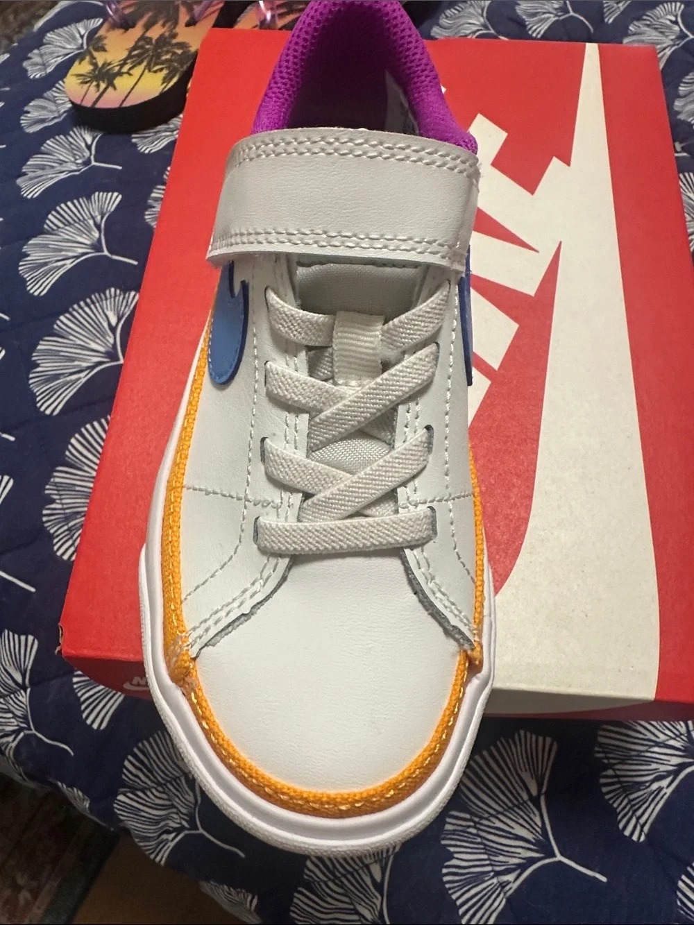Nike Kids White Sneaker with Blue Swoosh and Purple Lining